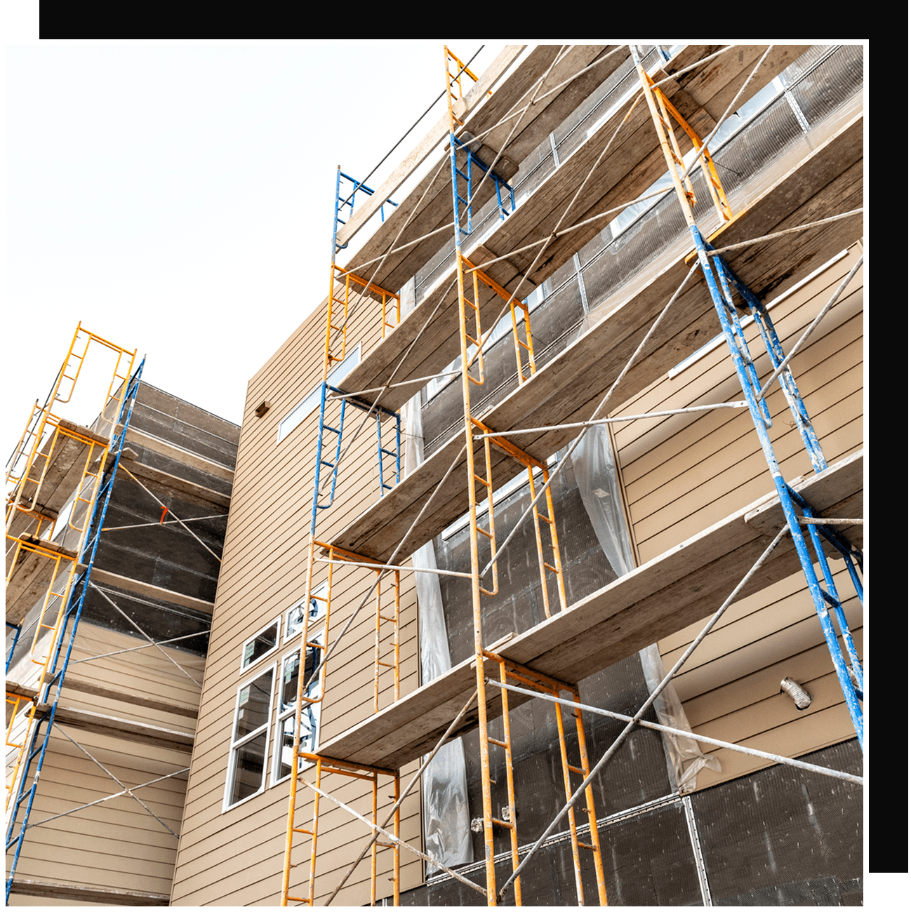 Building exterior under construction with scaffolding
