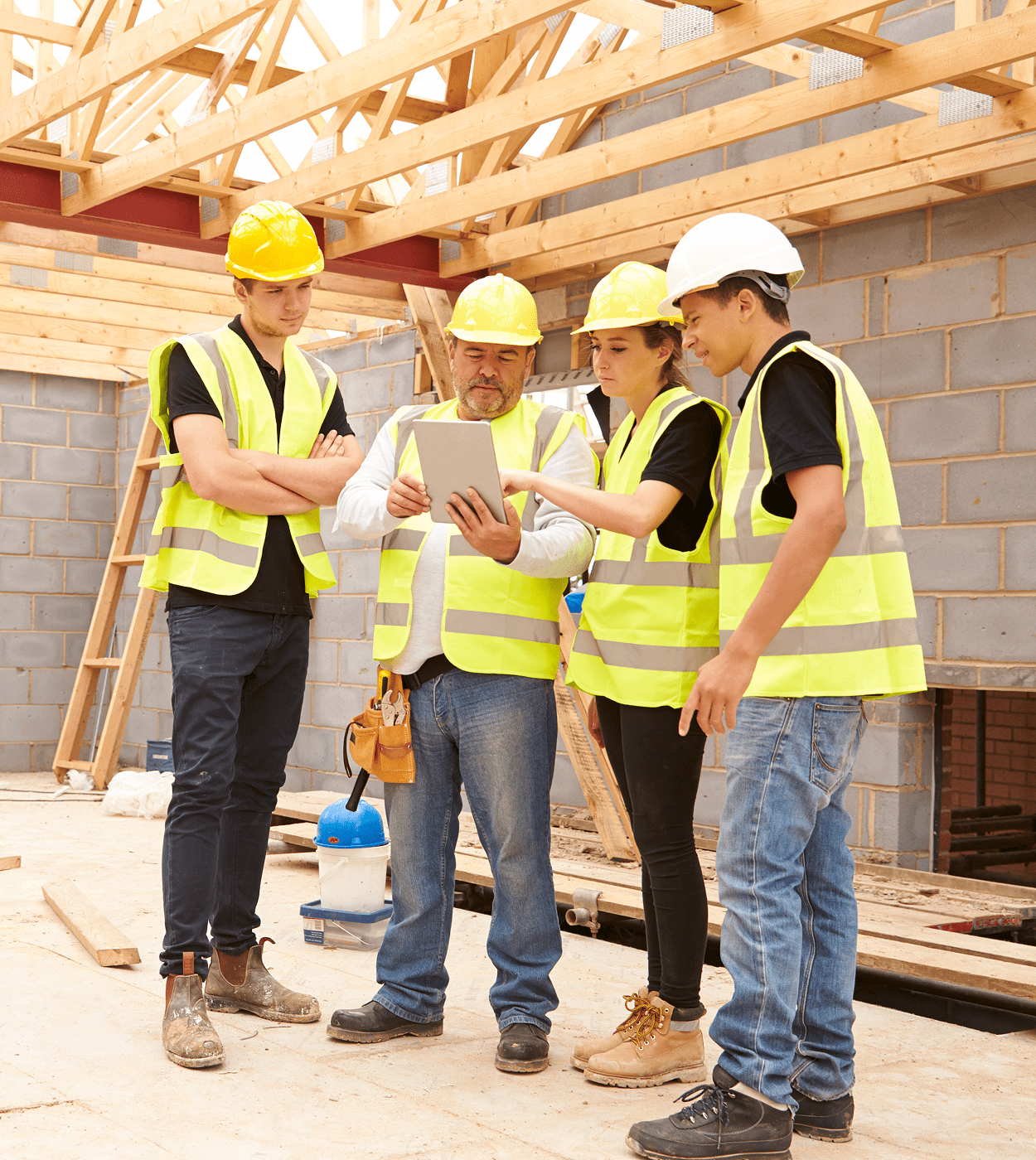 Construction crew reviewing plans on tablet