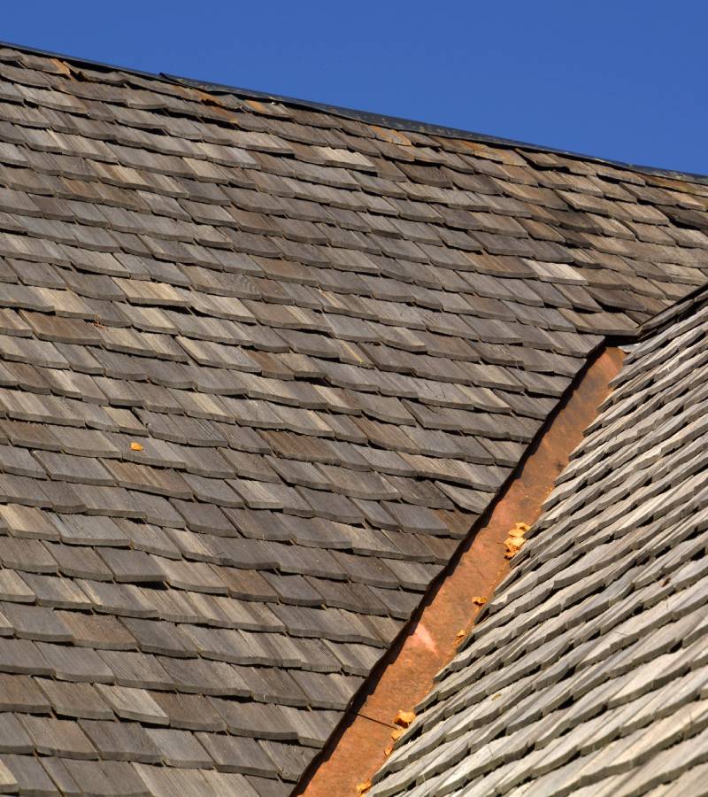 Wood shingle roof with metal valley flashing