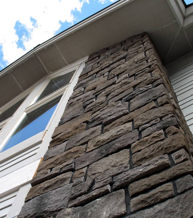 Low-angle view of stone exterior house column