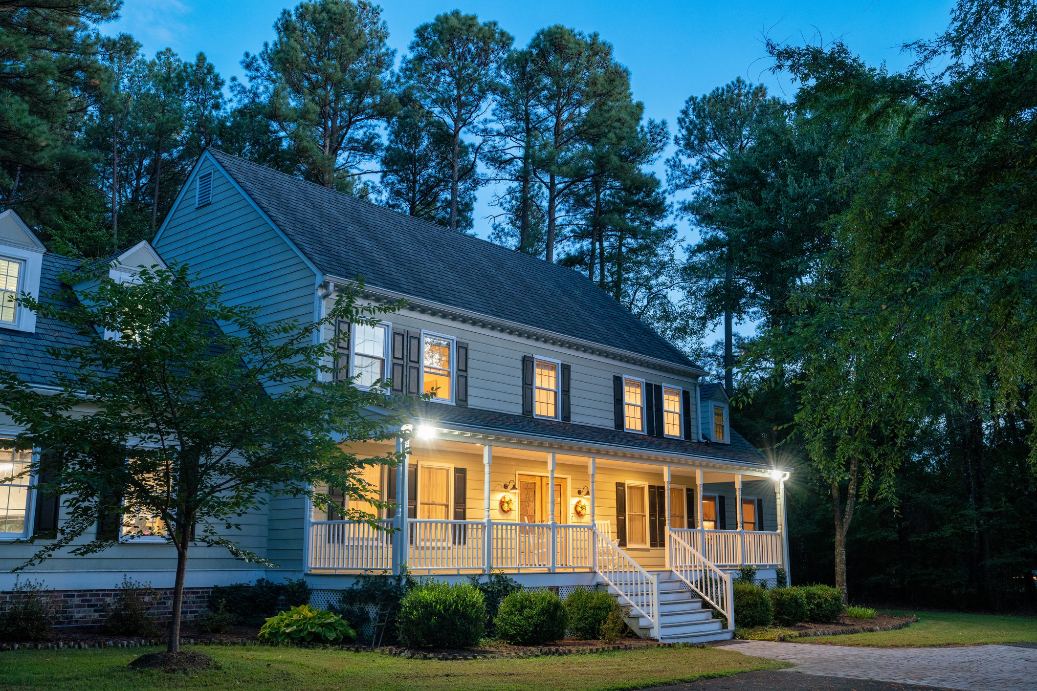 Two-story house with illuminated front porch