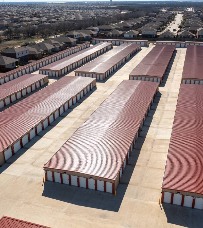 Aerial view of red-roofed self-storage units
