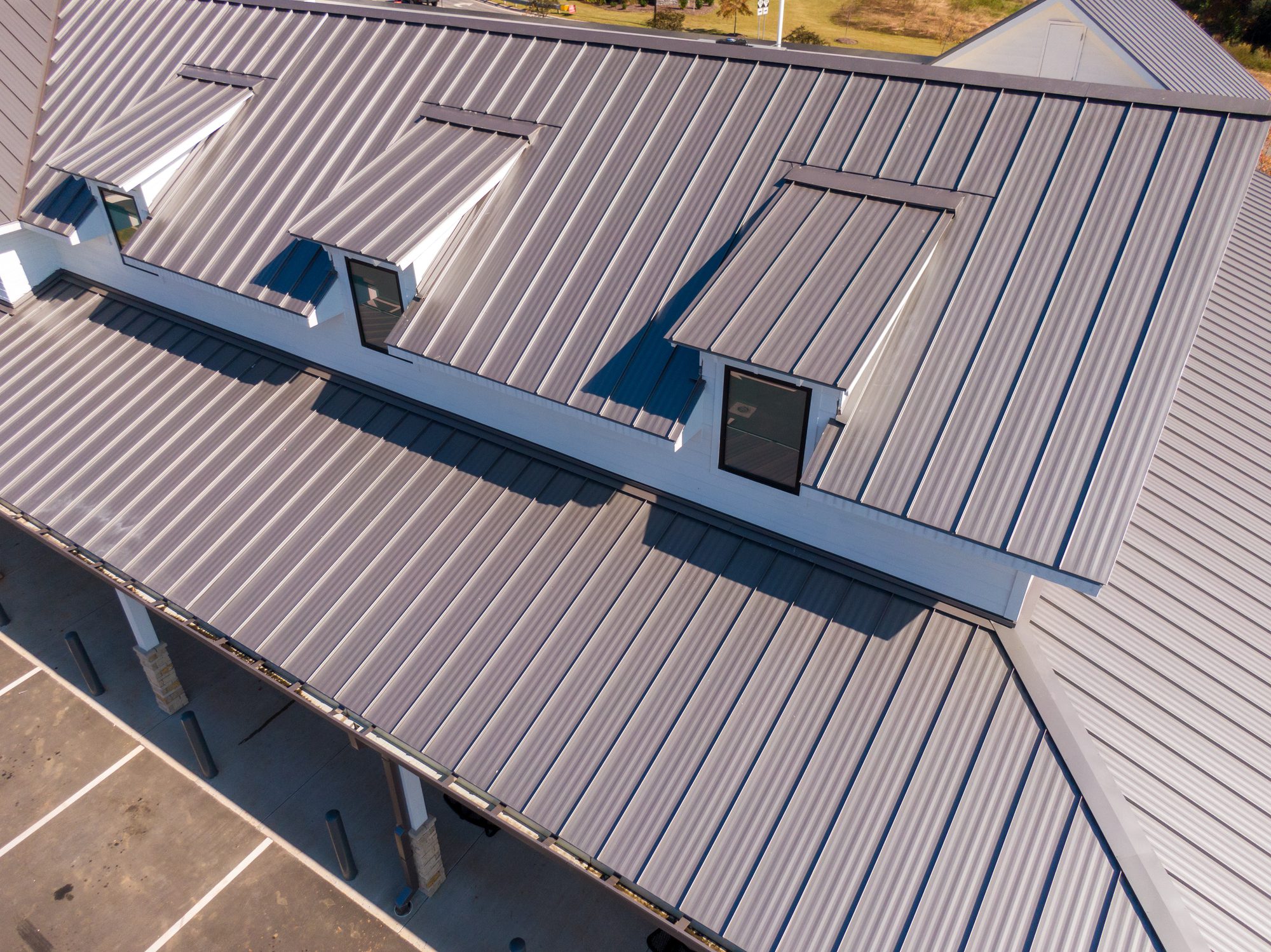 Aerial view of gray metal roof with skylights