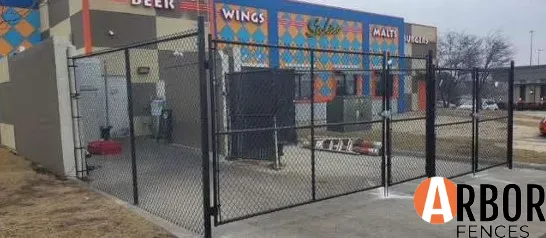 Chain link fence enclosing restaurant outdoor seating