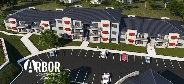 Aerial view of modern apartment complex and parking