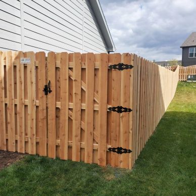 Wooden backyard privacy fence with gate