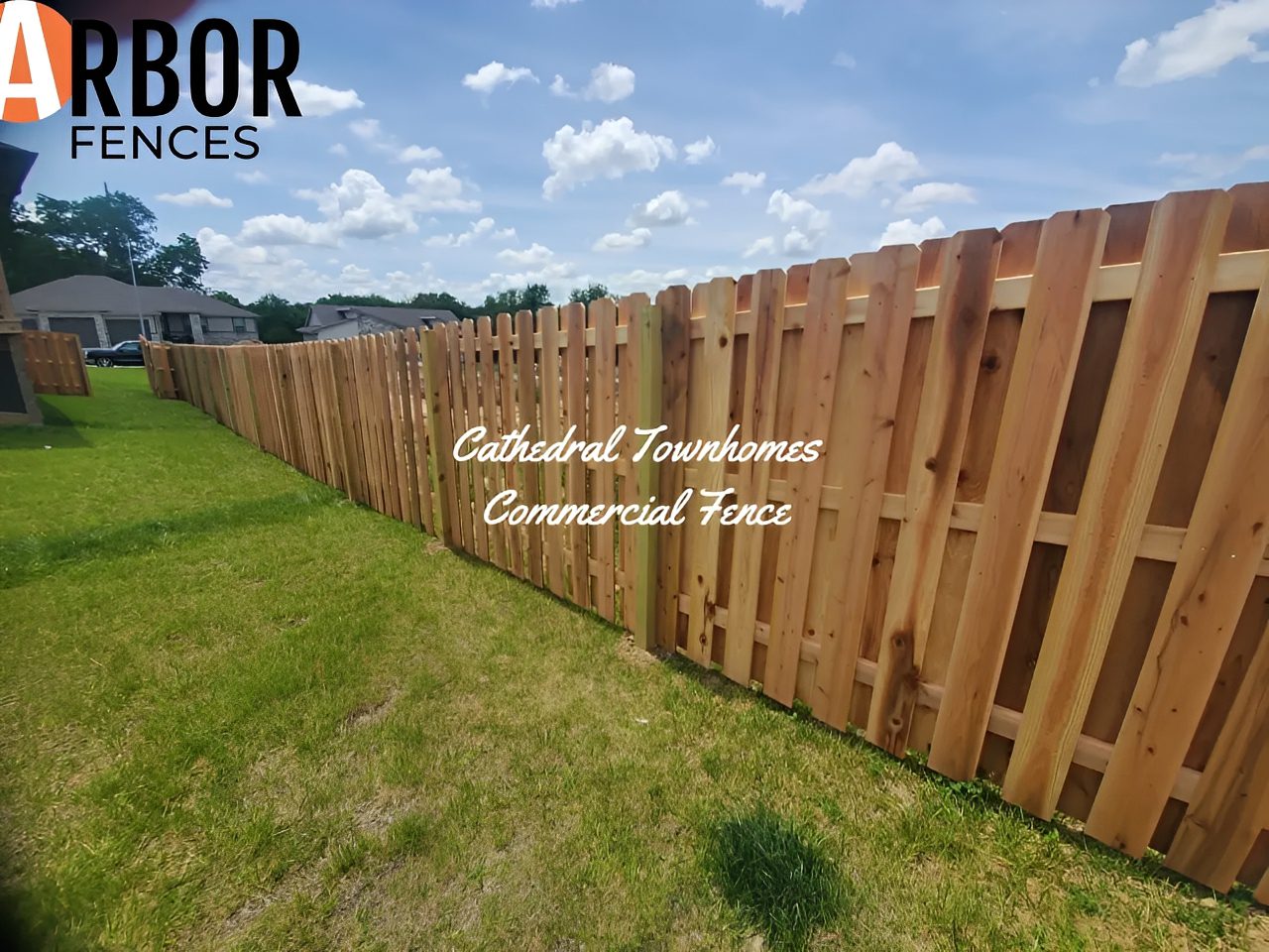 Wood privacy fence along grassy townhome yard