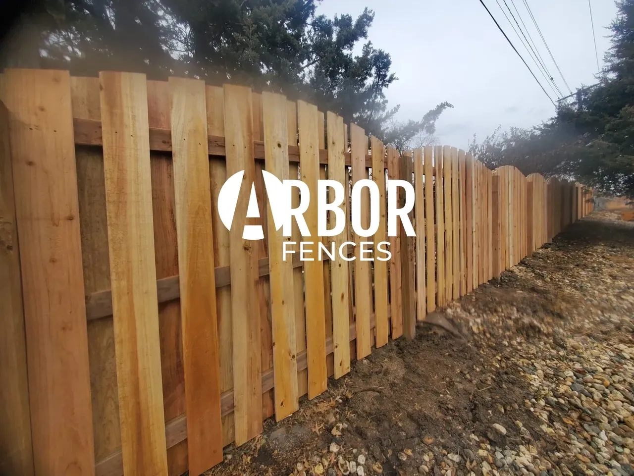 New wooden fence with scalloped top