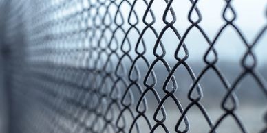 Close-up chain-link fence with blurred background
