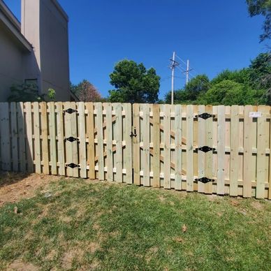 Light wooden fence with double gate