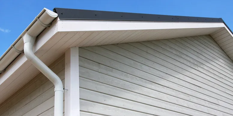 Gutter and downspout on house roof