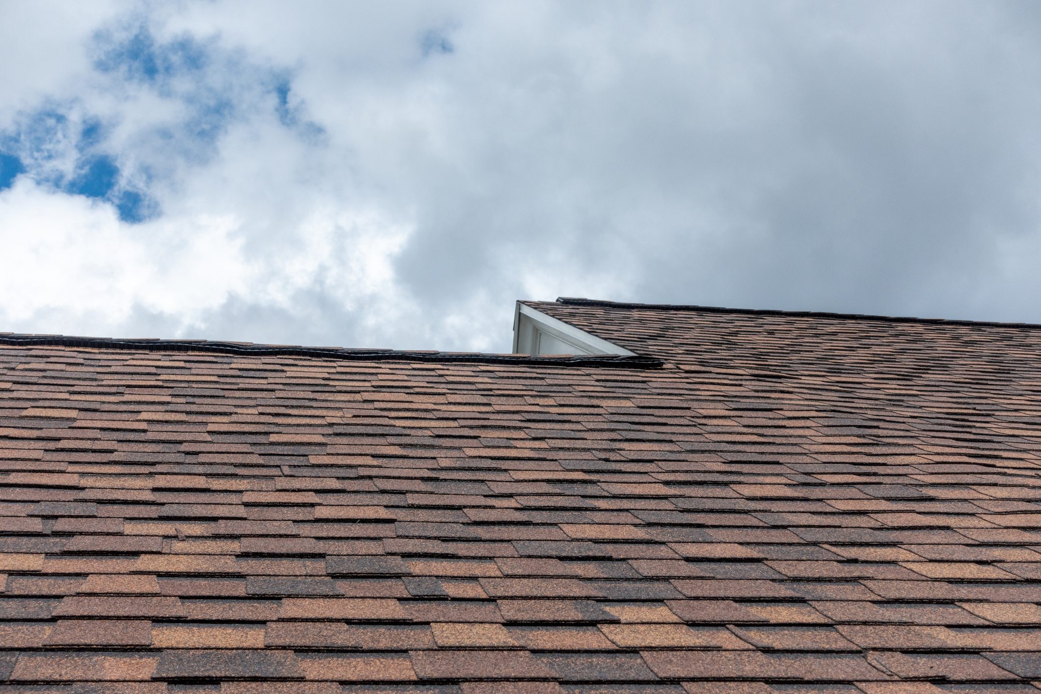 Colonial style roof shingles against sky. Selective focus.Shallow Depth of field - image