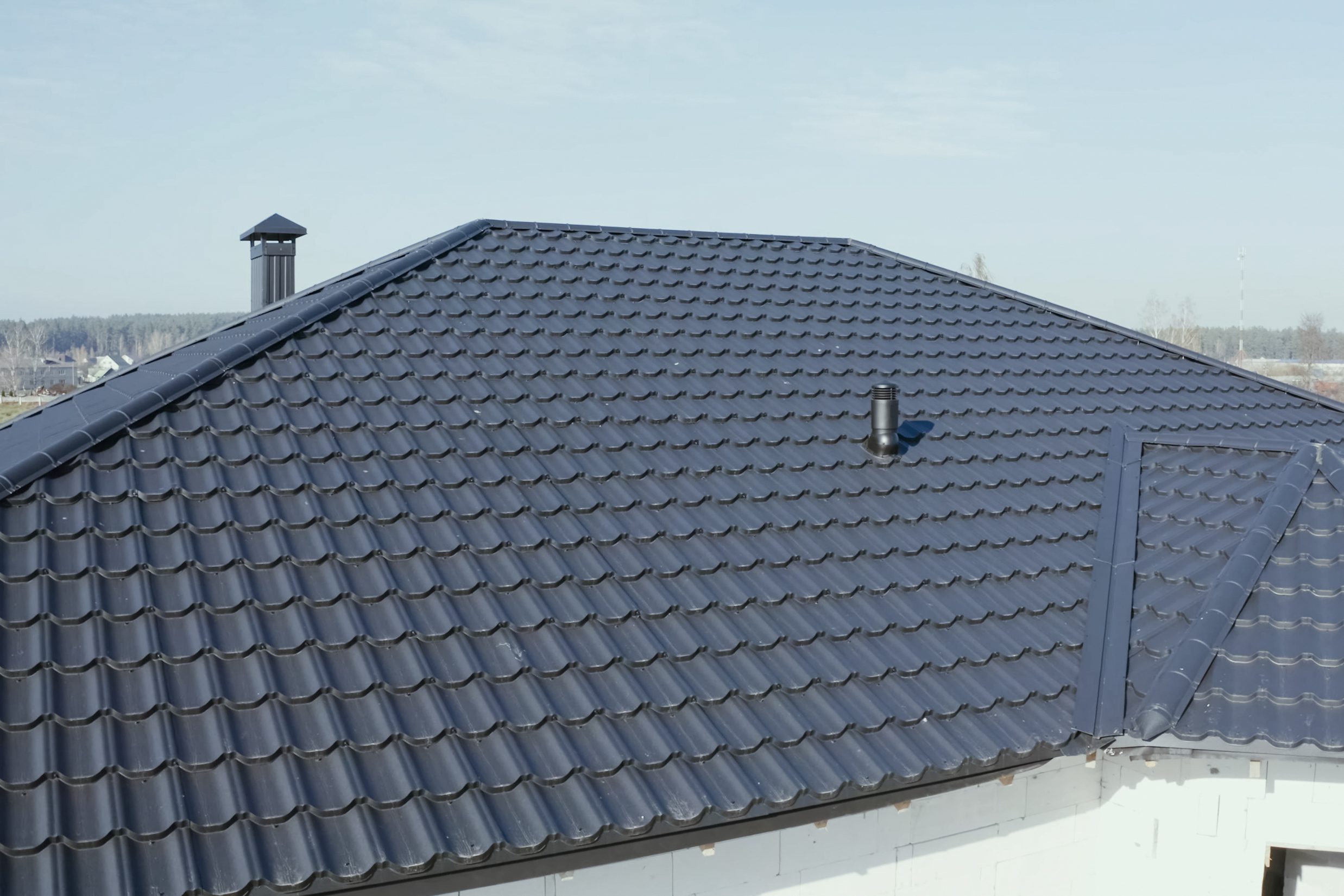 Modern roof made of metal. Corrugated metal roof and metal roofing.