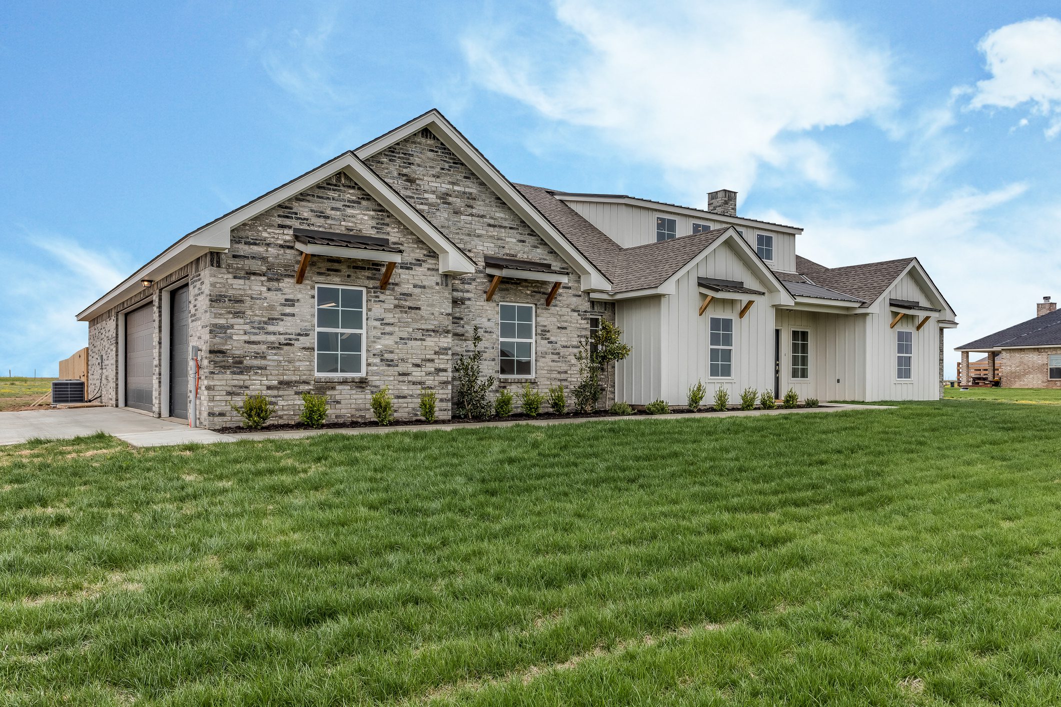 Freshly laid sod and newly constructed home
