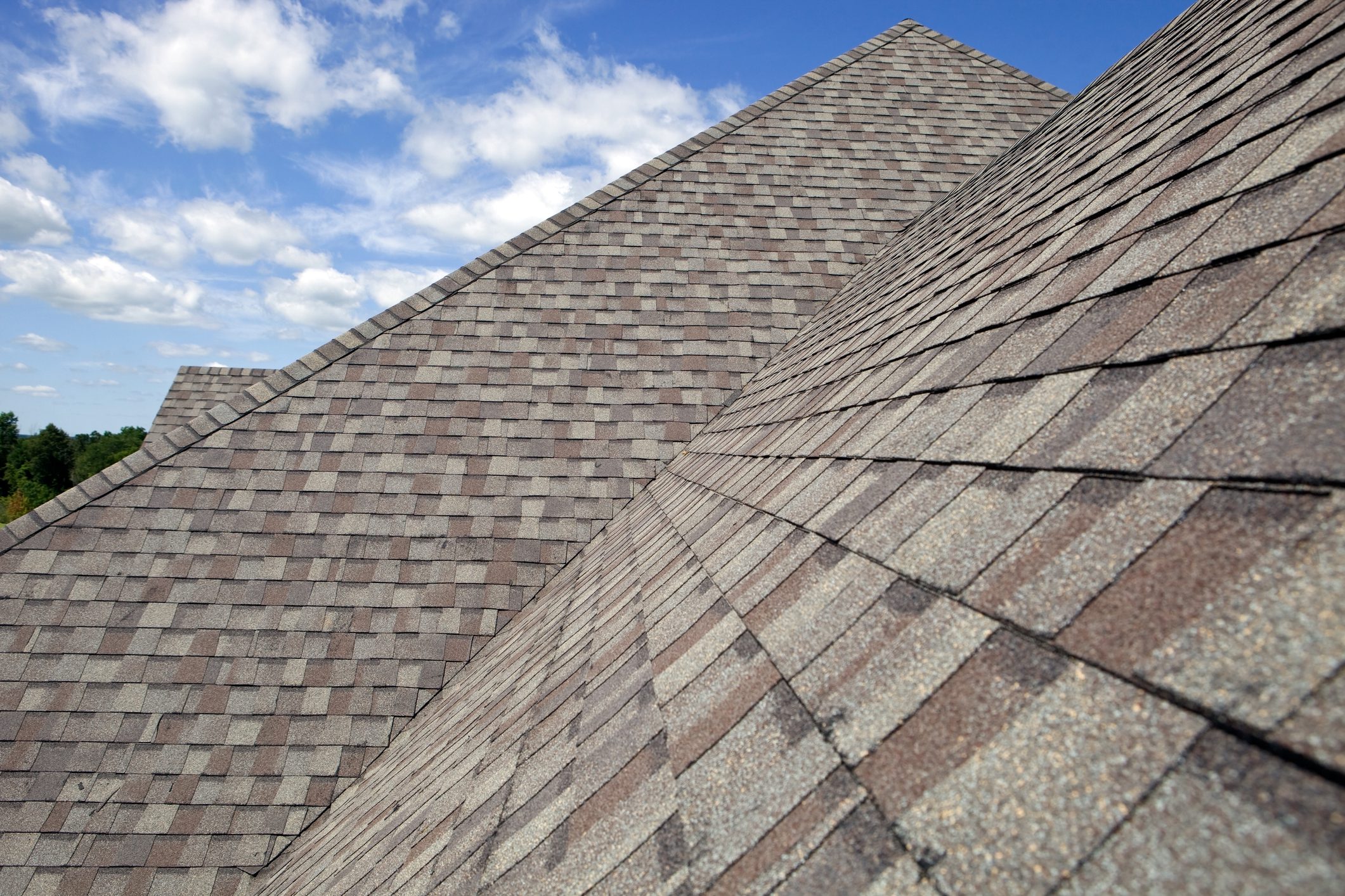 New Shingled Roof with Blue Sky Background