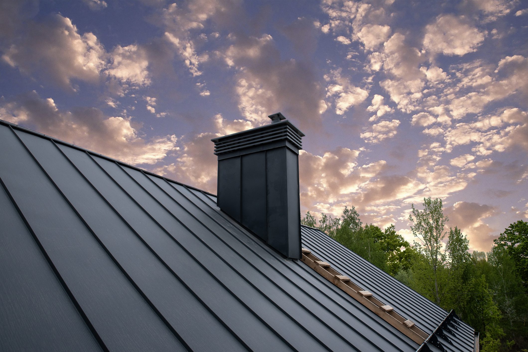 Modern metal chimney on the roof for ventilation