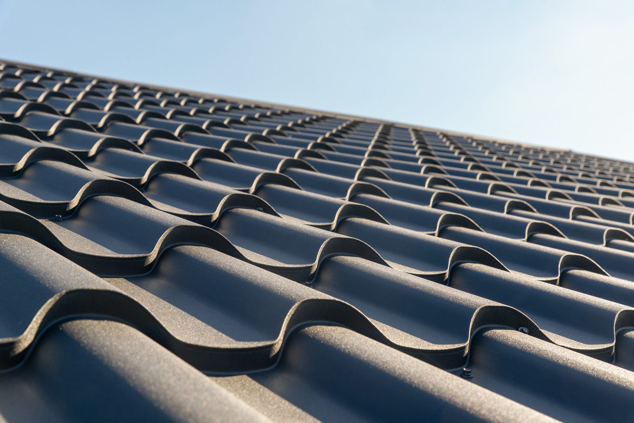 The roof of the house is covered with metal tiles