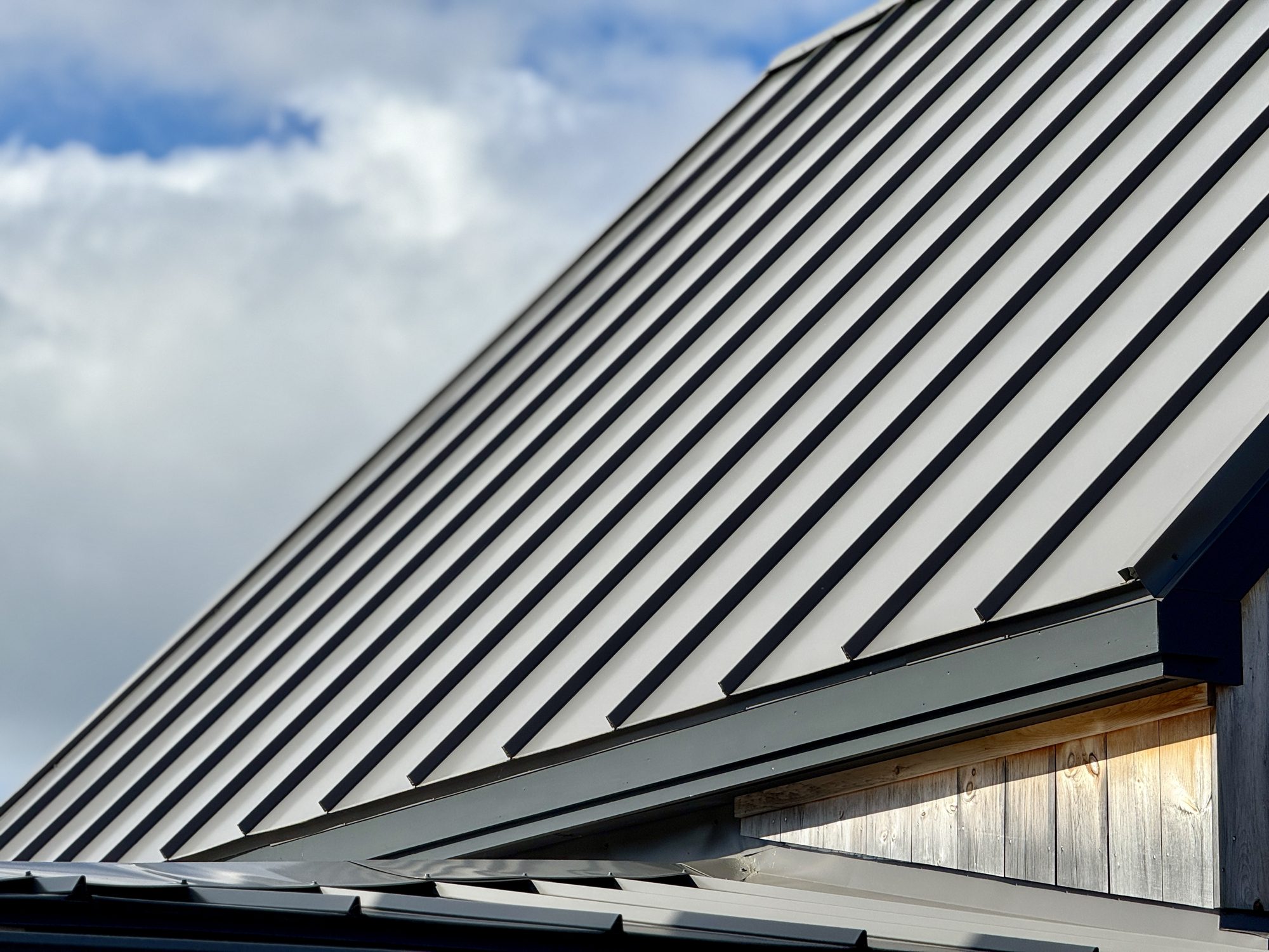 A roof with gray trapezoidal sheet metal