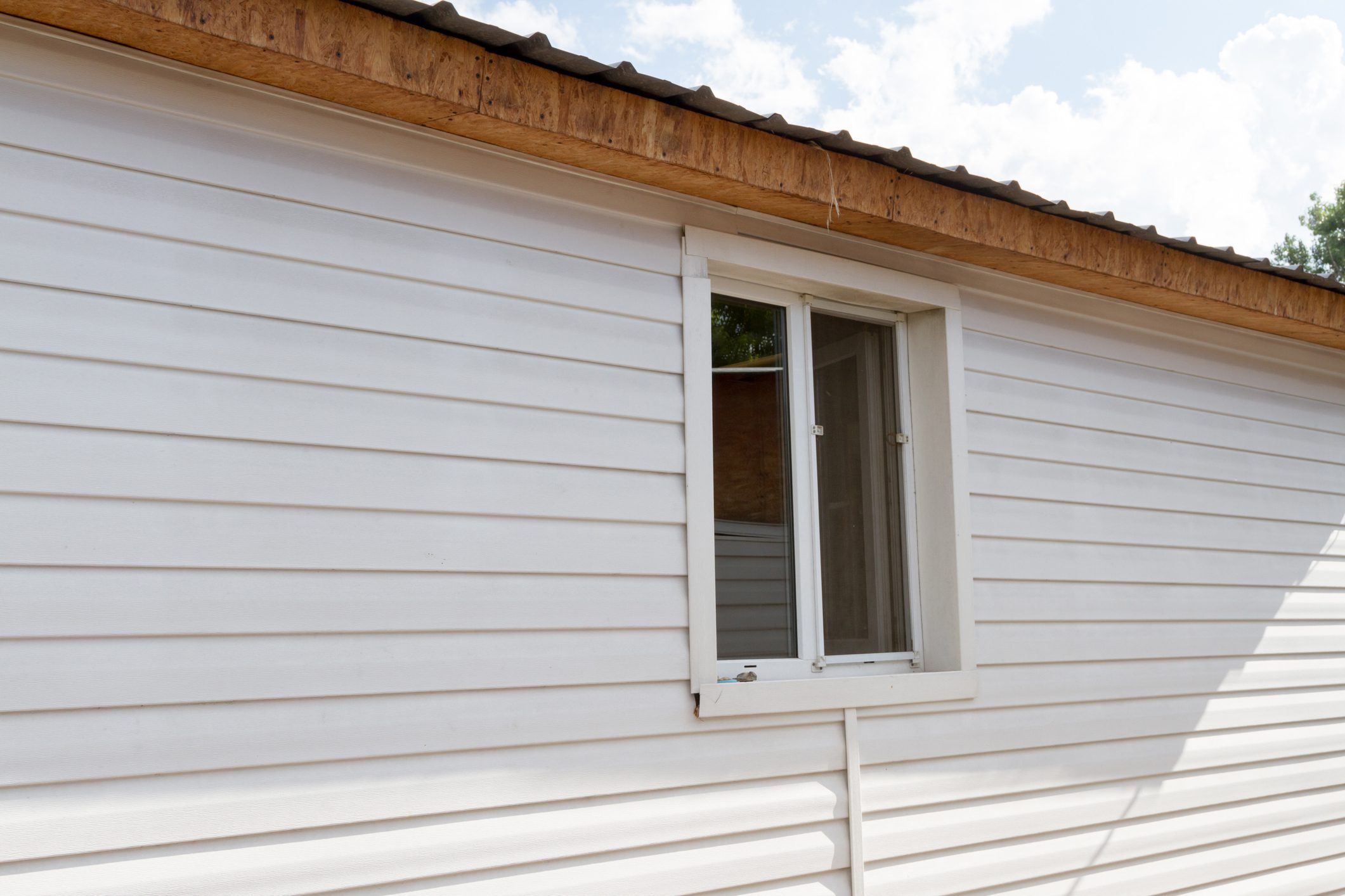window with the external side of the finished house siding