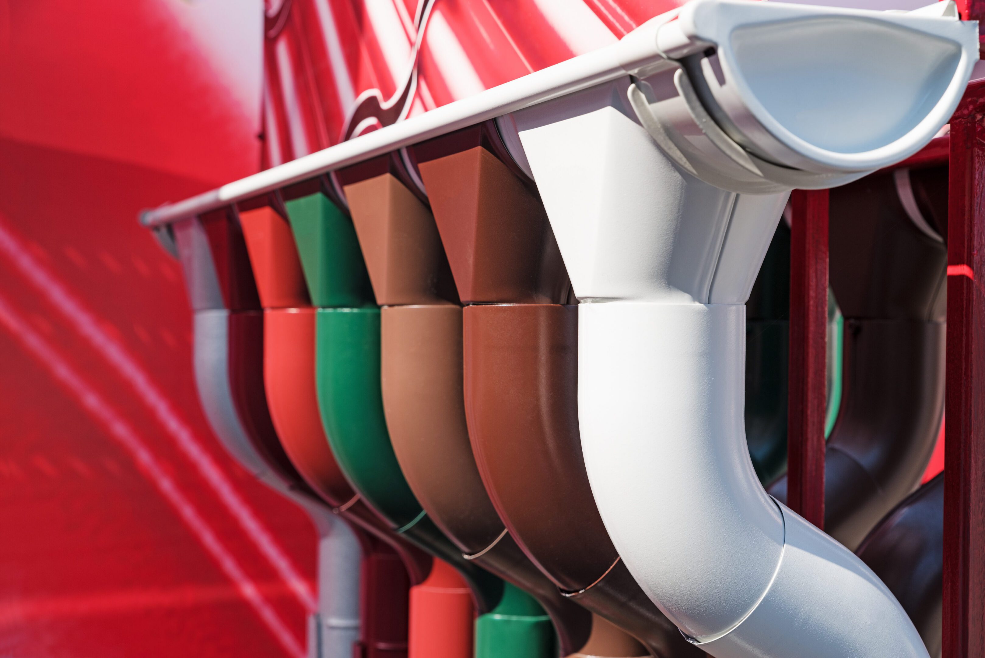 Closeup of rain gutter and downspout. Different color options. Selective focus.